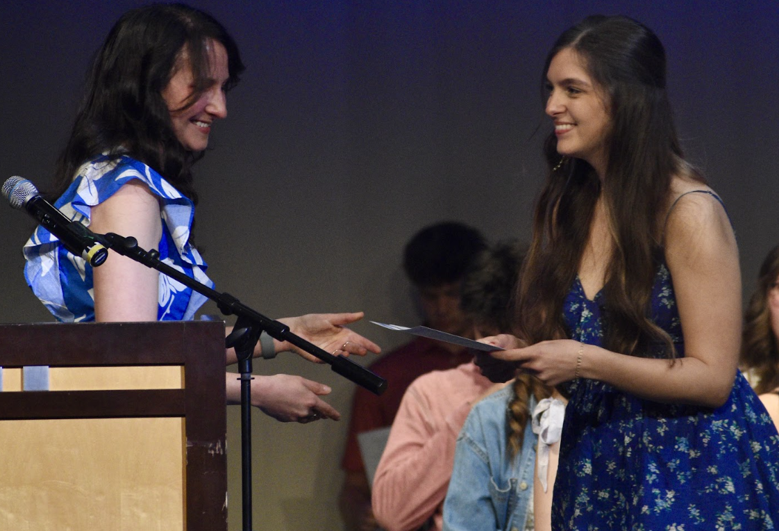 Natalie Hurles (12) accepts her award with a smile. “I felt so grateful all the hard work finally paid off,” Hurles said. 